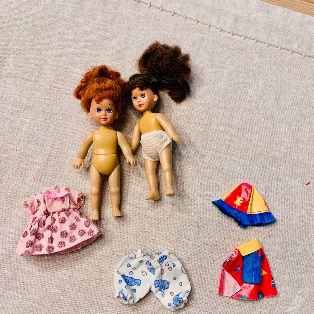 plastic doll house sized dolls (2) with rain coat hat and dress pants outfits